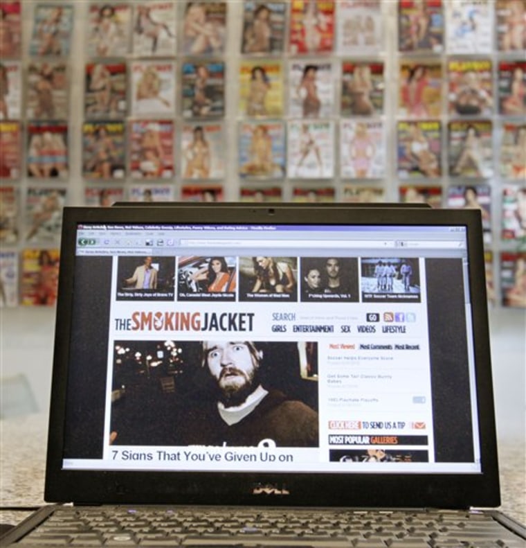 A laptop displays the website the smokingjacket.com, that Playboy says is safe to look at while at work — welcome news for men tired of throwing themselves over their computer screens whenever the boss walks by.